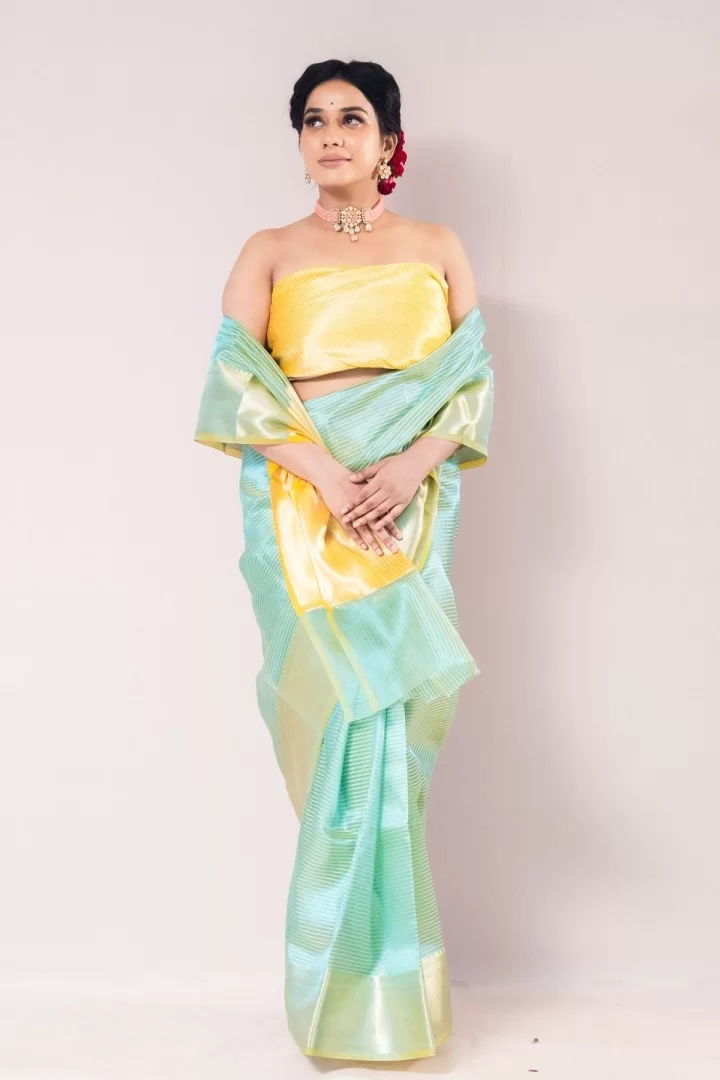 Splendid Parrot Green Tissue Strip Saree